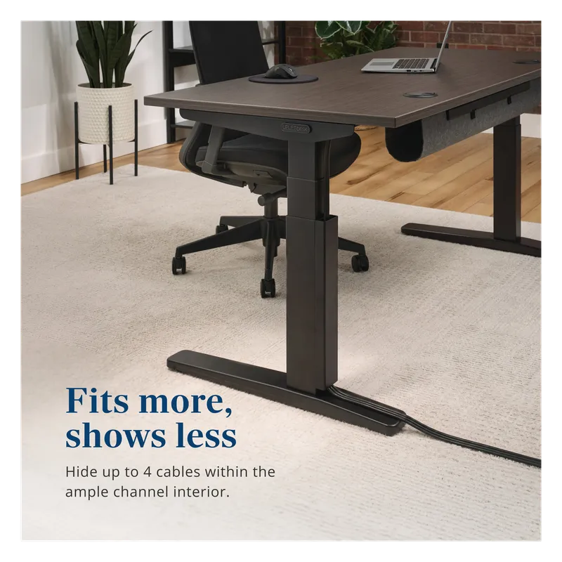 UPLIFT magnetic cable channel hiding cords along a black standing desk leg