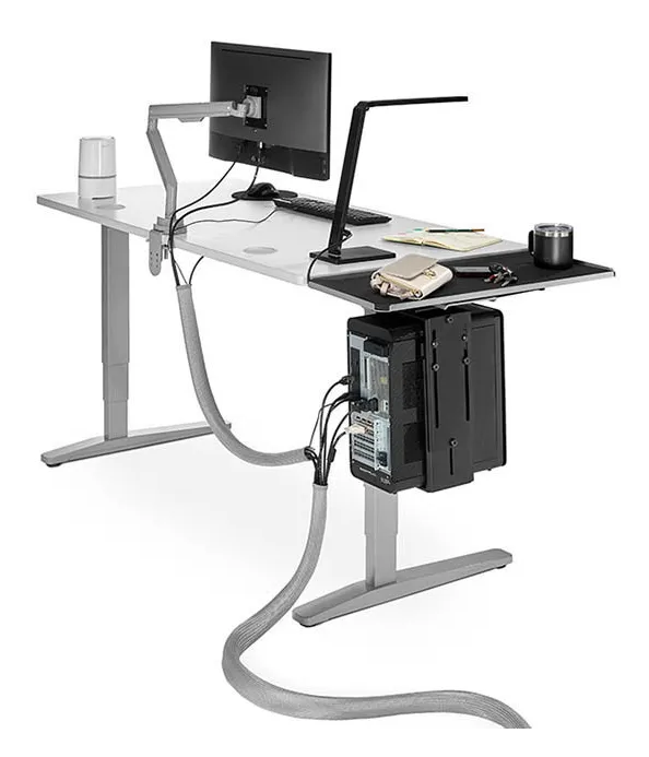 UPLIFT zipped cable sleeve running from a standing desk to the floor