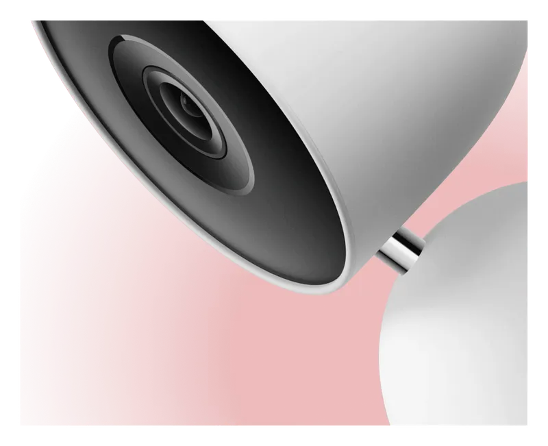 Close-up of the Google Nest Cam Indoor wired camera lens and stand