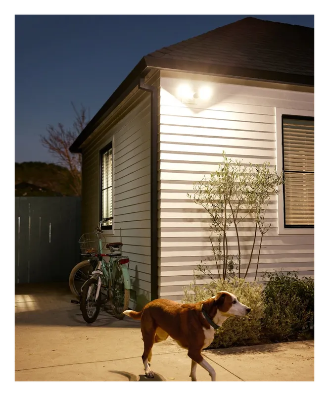 Google Nest Cam (Battery) mounted outside a house at night