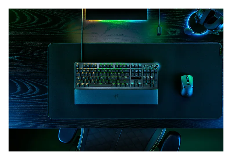Razer Huntsman V3 Pro keyboard on a gaming desk with a mouse