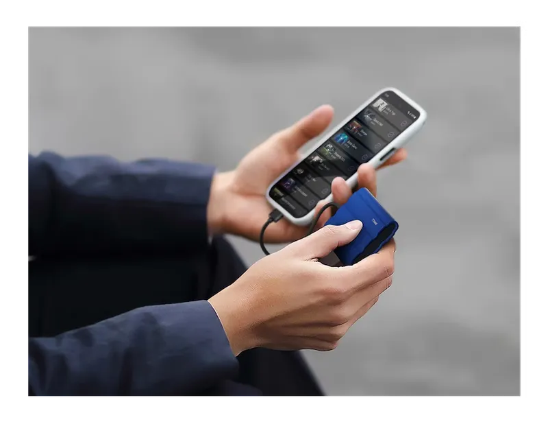 Samsung T7 Shield portable SSD connected to a smartphone