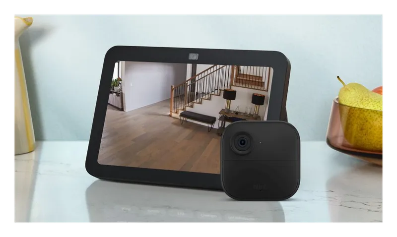 Blink Outdoor 4 camera next to an Echo Show displaying its live view