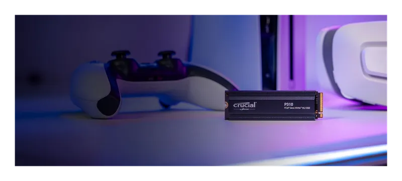 Crucial P310 SSD beside a PlayStation 5 controller