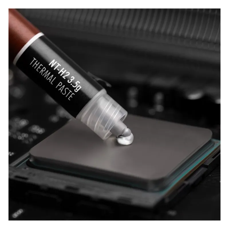 Noctua NT-H2 thermal paste being applied to a CPU