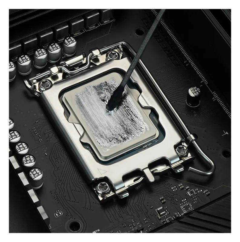 Thermal Grizzly Conductonaut spread thinly across a CPU heat spreader