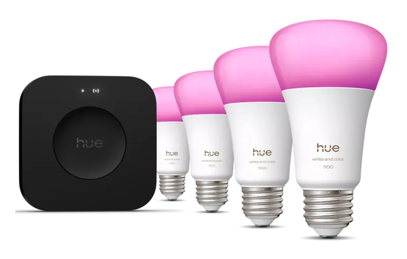 Philips Hue Bridge Pro Starter Kit with the black Bridge Pro and four color A19 bulbs glowing pink