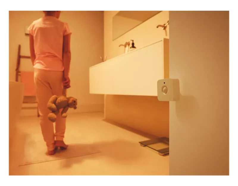 Philips Hue Motion Sensor turning on a dim night light for a child in a bathroom