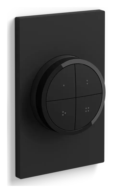 Philips Hue Tap Dial Switch on its black wall plate