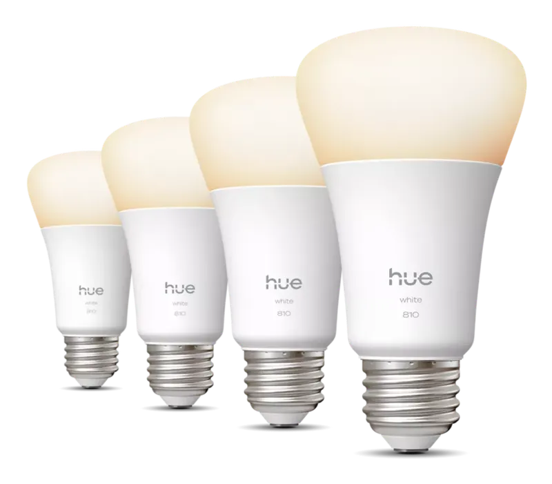 Four Philips Hue White A19 bulbs glowing soft white